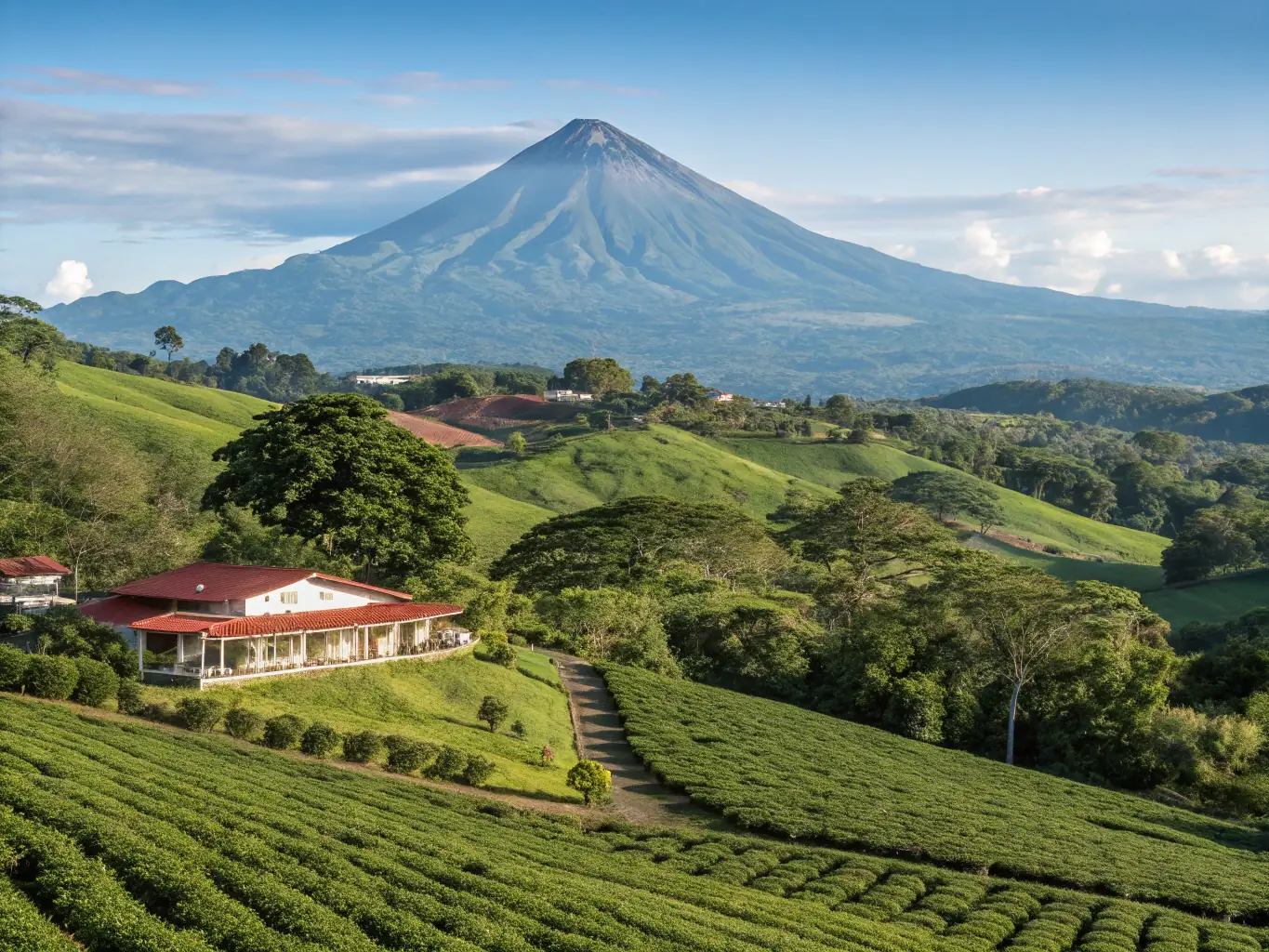 A picturesque image of La Fortuna and the Arenal Volcano in Costa Rica, showcasing the volcano's majestic peak, lush green landscapes, and the charming town below. The scene captures the essence of adventure and natural beauty, inviting viewers to explore the region's wonders.